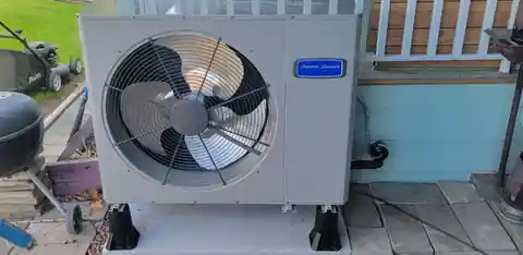 New American Standard heat pump on a porch deck